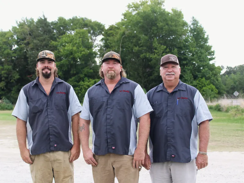 Three-man crew in Lee's Plumbing uniforms, from Lee's Plumbing’s own photographs.