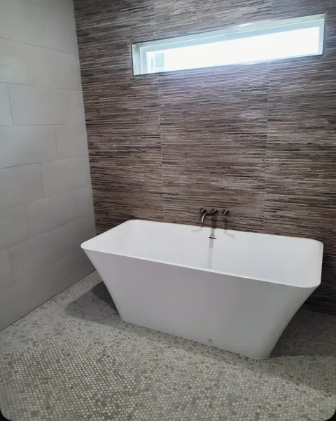Freestanding tub install, from PrimeTime Plumbing’s own photographs.