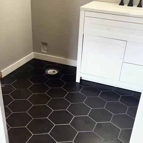 Vanity and hex-tile floor, from Jennings Plumbing’s own photographs.