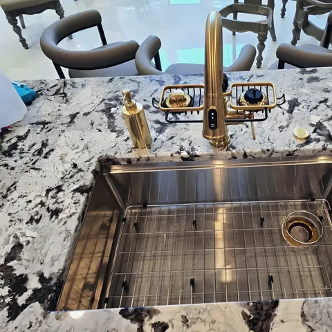 Gold kitchen faucet and workstation sink install, from PrimeTime Plumbing’s own photographs.