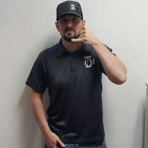 Uniformed TDi team member, from TDi Services’s own photographs.